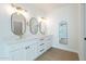 Elegant bathroom with double vanity and large oval mirrors at 3877 S Veronica Ln, Gold Canyon, AZ 85118