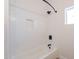Clean bathroom with white subway tile, shower, and built-in shelf at 3877 S Veronica Ln, Gold Canyon, AZ 85118