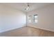 Bright bedroom with wood floors and ceiling fan at 3877 S Veronica Ln, Gold Canyon, AZ 85118