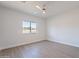 Bedroom with wood-look floors, ceiling fan, and window with views at 3877 S Veronica Ln, Gold Canyon, AZ 85118
