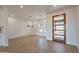 Bright dining room with wood floors and modern light fixture at 3877 S Veronica Ln, Gold Canyon, AZ 85118