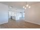 Open dining area with wood floors and kitchen views at 3877 S Veronica Ln, Gold Canyon, AZ 85118