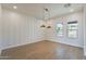 Dining room features wood floors and a farmhouse style wall at 3877 S Veronica Ln, Gold Canyon, AZ 85118