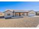 Front view of a house with modern design and a covered porch at 3877 S Veronica Ln, Gold Canyon, AZ 85118