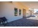 Covered patio with paver stones and a black folding chair at 3877 S Veronica Ln, Gold Canyon, AZ 85118