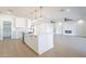 Open concept kitchen with island, stainless steel appliances, and views to living area at 3877 S Veronica Ln, Gold Canyon, AZ 85118