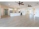 Modern white kitchen with large island and stainless steel appliances at 3877 S Veronica Ln, Gold Canyon, AZ 85118