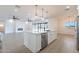 Open concept kitchen with island, stainless steel appliances, and views to living area at 3877 S Veronica Ln, Gold Canyon, AZ 85118