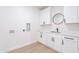 Laundry room with white cabinets and quartz countertops at 3877 S Veronica Ln, Gold Canyon, AZ 85118