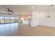 Open living room with kitchen and sliding glass doors to backyard at 3877 S Veronica Ln, Gold Canyon, AZ 85118