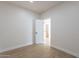 Small spare bedroom with door to adjacent bathroom at 3877 S Veronica Ln, Gold Canyon, AZ 85118