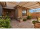 Stone courtyard with lush greenery and a pergola for shade at 41405 N Clear Crossing Rd, Anthem, AZ 85086