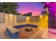 Fire pit and seating area in a colorful backyard patio at 419 E Oxford Dr, Tempe, AZ 85283