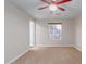 Bright bedroom with ceiling fan and window view at 419 E Oxford Dr, Tempe, AZ 85283