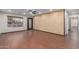 Bright living room with hardwood floors, large window, and ceiling fan at 419 E Oxford Dr, Tempe, AZ 85283