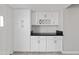 White cabinets and black countertops highlight this kitchen's updated look at 4701 N 68Th St # 248, Scottsdale, AZ 85251