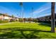 Green lawn with a view of the community pool and building at 4701 N 68Th St # 248, Scottsdale, AZ 85251