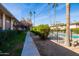 Pathway alongside a lush green lawn and pool at 4701 N 68Th St # 248, Scottsdale, AZ 85251