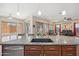 Granite countertops and a large kitchen island sink overlooking the living room at 5344 N Crestland Ct, Litchfield Park, AZ 85340