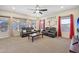 Relaxing living room with leather reclining furniture and a large TV at 5344 N Crestland Ct, Litchfield Park, AZ 85340