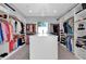 Large walk-in closet with ample shelving and hanging space for clothing and shoes at 6521 N 4Th St, Phoenix, AZ 85012