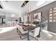 Elegant dining room with a long wooden table and modern chandelier at 6521 N 4Th St, Phoenix, AZ 85012