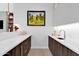 Modern kitchen with white countertops and dark wood cabinets at 6521 N 4Th St, Phoenix, AZ 85012