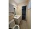 Clean bathroom with vanity, toilet, and access to bedroom at 7407 E Fillmore St, Scottsdale, AZ 85257