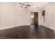 Bedroom with hardwood floors, sliding door, and ceiling fan at 9246 W Molly Ln, Peoria, AZ 85383