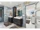 Elegant bathroom with double sinks, a large mirror and modern fixtures at 1101 N Christa Way, Tolleson, AZ 85353