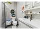 Clean bathroom with white vanity, toilet, and shower at 1101 N Christa Way, Tolleson, AZ 85353