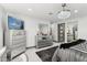 Stylish bedroom with a dresser, mirror, and ample closet space at 1101 N Christa Way, Tolleson, AZ 85353