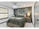 Serene bedroom with a bed, nightstand and window at 1101 N Christa Way, Tolleson, AZ 85353