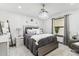 Comfortable bedroom with a queen-size bed, plush bedding, and plenty of natural light at 1101 N Christa Way, Tolleson, AZ 85353