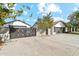 Modern home exterior with stylish black gate and driveway at 1101 N Christa Way, Tolleson, AZ 85353