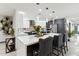 Modern kitchen with white quartz countertops and stainless steel appliances at 1101 N Christa Way, Tolleson, AZ 85353