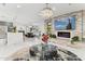 Open concept living area with modern fireplace and large TV at 1101 N Christa Way, Tolleson, AZ 85353