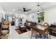 Open living room and kitchen area with dining table and comfortable couch at 1101 N Christa Way, Tolleson, AZ 85353