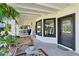 Relaxing covered patio with seating area and access to the backyard at 1101 N Christa Way, Tolleson, AZ 85353
