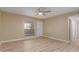 Spacious bedroom with wood-look floors and ceiling fan at 1340 N Recker Rd # 131, Mesa, AZ 85205