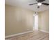 Bright bedroom with ceiling fan and wood-look floors at 1340 N Recker Rd # 131, Mesa, AZ 85205
