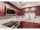 Modern kitchen with stainless steel appliances and granite countertops at 1340 N Recker Rd # 131, Mesa, AZ 85205