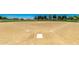 Community baseball field with marked bases and surrounding landscaping at 18066 W Weatherby Dr, Surprise, AZ 85374