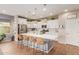 Bright kitchen with island, stainless steel appliances, and white cabinets at 20142 W Sherman St, Buckeye, AZ 85326