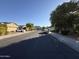 Residential street view showcasing nearby homes and landscaping at 39972 W Pryor Ln, Maricopa, AZ 85138