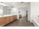 Bathroom with double vanity, large mirror, and a separate bathtub at 41375 N Salix Dr, San Tan Valley, AZ 85140