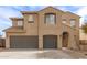 Front exterior view of a two-story stucco home with a brown tiled roof at 41375 N Salix Dr, San Tan Valley, AZ 85140