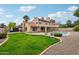 Landscaped backyard with grassy lawn and pool at 5544 E Paradise Ln, Scottsdale, AZ 85254