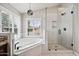 Spa-like bathroom featuring a corner tub and glass shower at 5544 E Paradise Ln, Scottsdale, AZ 85254