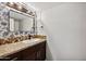 Bathroom boasts granite countertop, updated vanity, and patterned wallpaper at 5544 E Paradise Ln, Scottsdale, AZ 85254